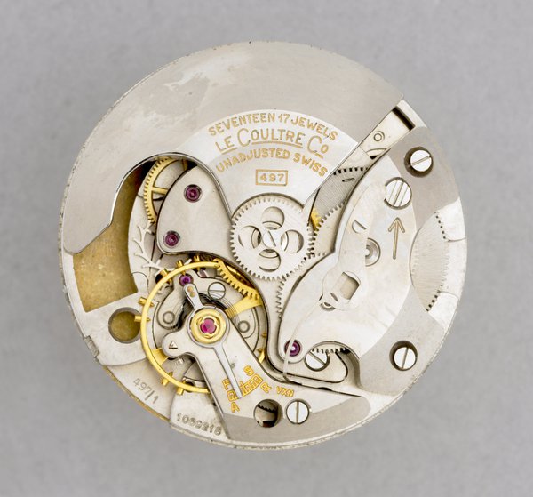 The movement of self-winding watch showing the winding weight.  Jaeger Le Coultre, Switzerland, 1959  (British Museum reg. No. 1988,0409.3)