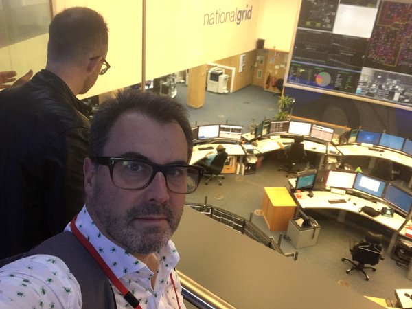 The EHG secretary and others in the viewing gallery, overlooking the main control room