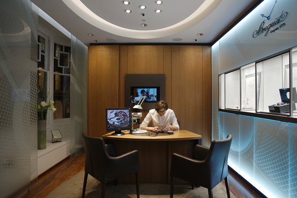 A Breguet watchmaker preparing for a busy evening of demonstrations (Photo Yarek Baranik)