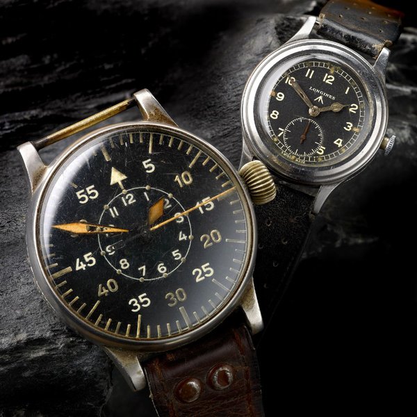 Left: Alloy cased manual wind German observers watch by A. Lange & Sohne c. 1940s Right: Stainless steel manual wind military issue “Greenlander” wrist watch by Longines