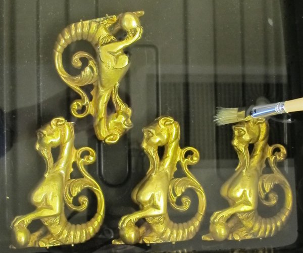 Cleaning ormolu figures in mild detergent and de-ionised water