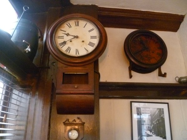 The clocks side by side — their hands frozen in time